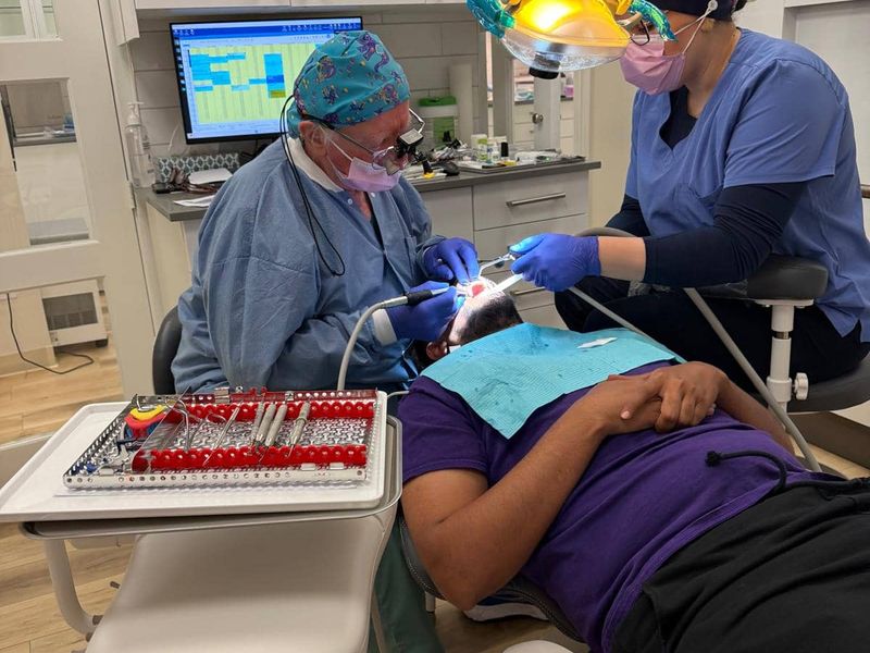 Smiling female patient during dental exam Ottawa