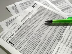 Canadian tax return form with pen
